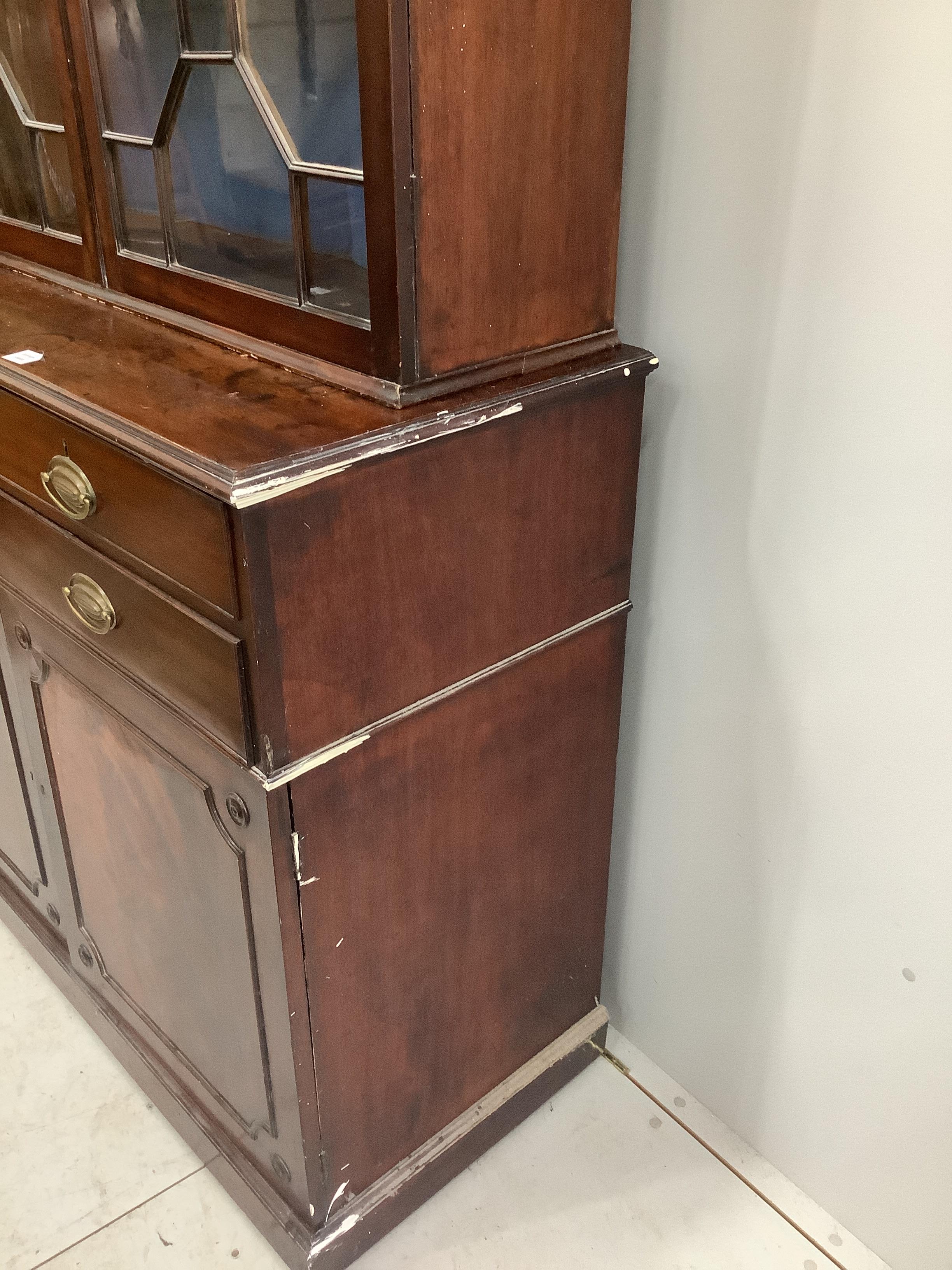 A George III mahogany bookcase cabinet, width 125cm, depth 53cm, height 242cm